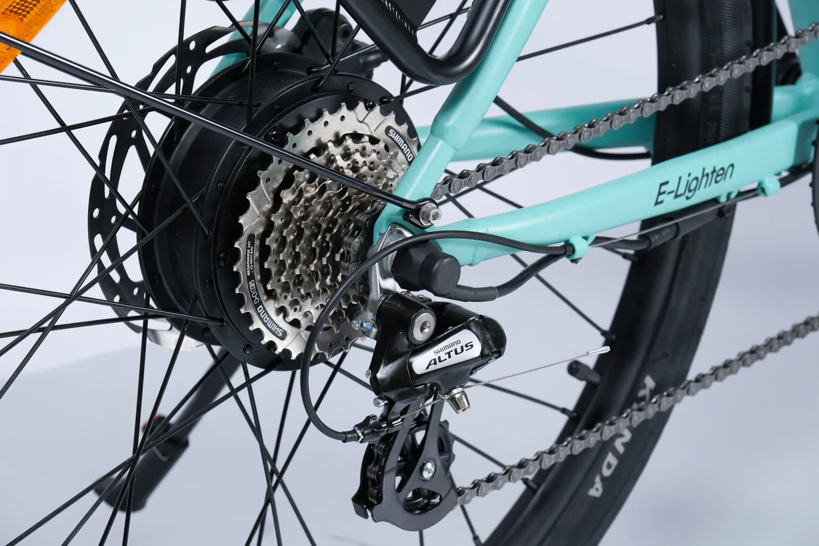 Original E-Lighten product photograph showing the rear hub, gears, and drivetrain